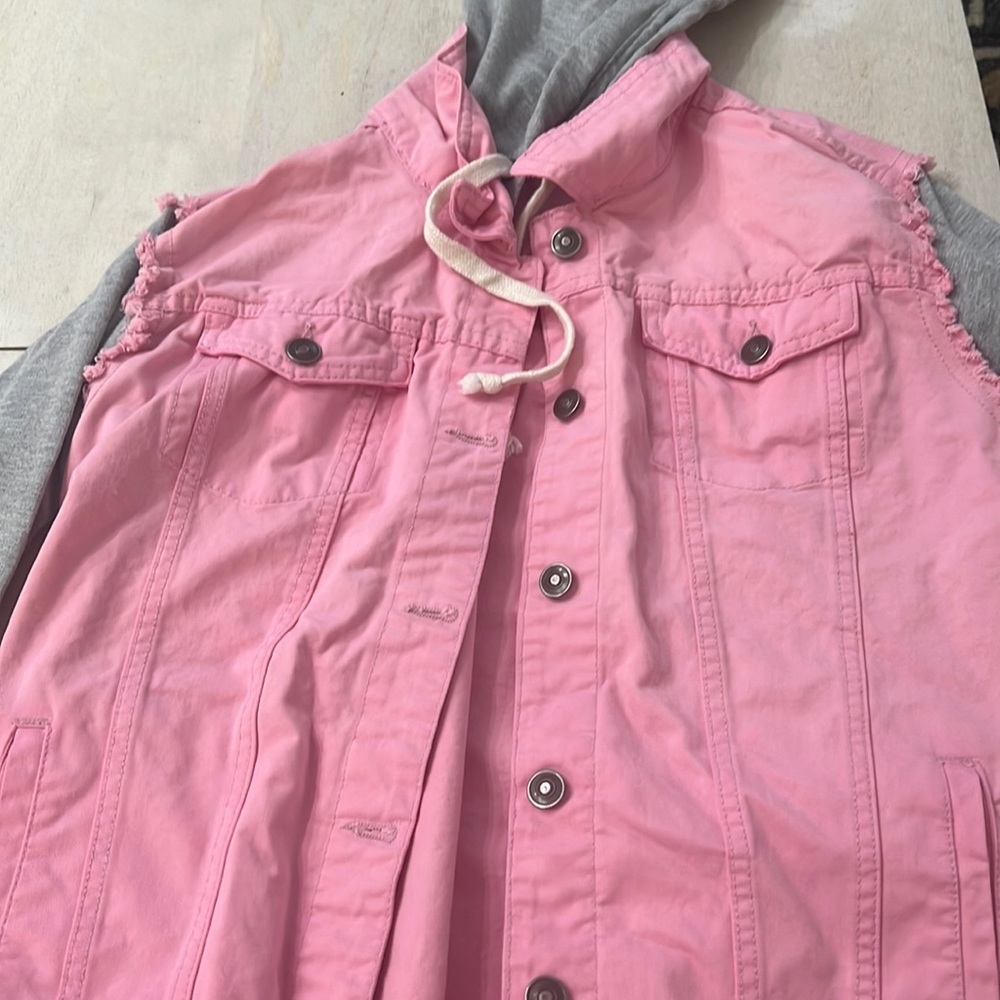 Pink denim jacket with gray sweatshirt sleeves with hood